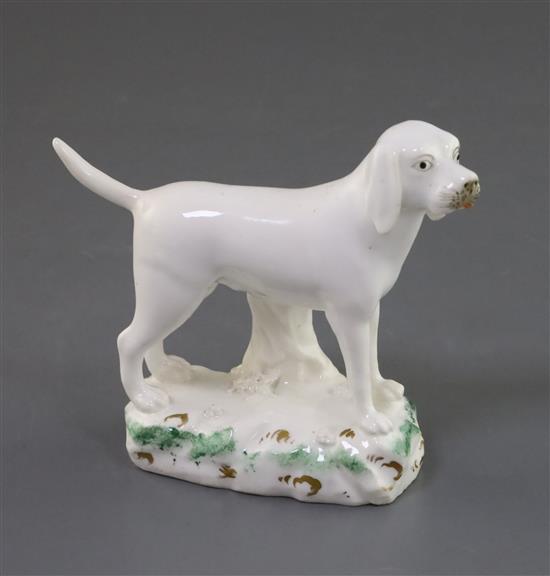 A Rockingham porcelain figure of a foxhound, c.1830, L. 11.8cm, restored tail